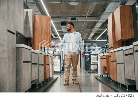 Furniture and cabinets. Man is in the hardware shop Furniture and cabinets. Man is in the hardware shop 133217828