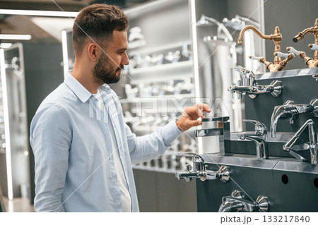 Stuff for the shower. Man is in the hardware shop Stuff for the shower. Man is in the hardware shop 133217840
