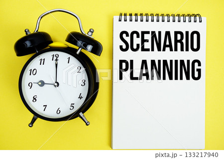 Scenario Planning text with alarm clock flat lay on yellow background 133217940