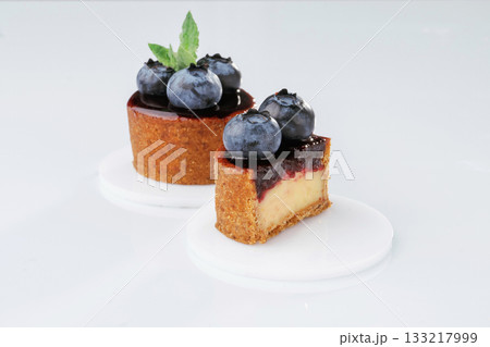 Made by professional baker. Delicious tart with blueberries against white background 133217999