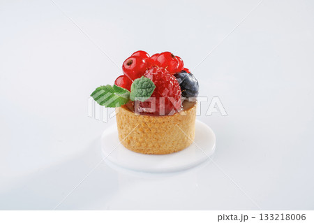 Summer fruits. Seasonal delicious tart against white background Summer fruits. Seasonal delicious tart against white background 133218006
