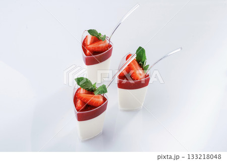 Sweet dessert is on the white surface against background 133218048