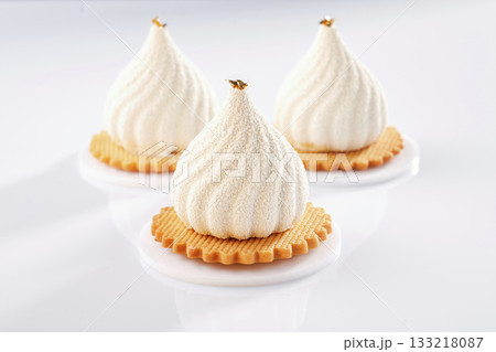 On the yellow cookie. Sweet cakes on the white surface On the yellow cookie. Sweet cakes on the white surface 133218087