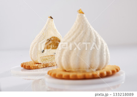 On the yellow cookie. Sweet cakes on the white surface On the yellow cookie. Sweet cakes on the white surface 133218089
