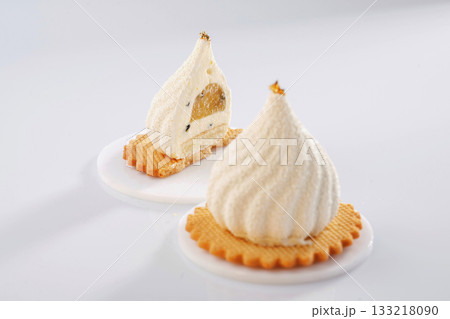 On the yellow cookie. Sweet cakes on the white surface On the yellow cookie. Sweet cakes on the white surface 133218090