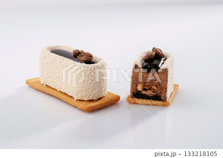 Lot of sugar. Sweet cakes on the white surface Lot of sugar. Sweet cakes on the white surface 133218105