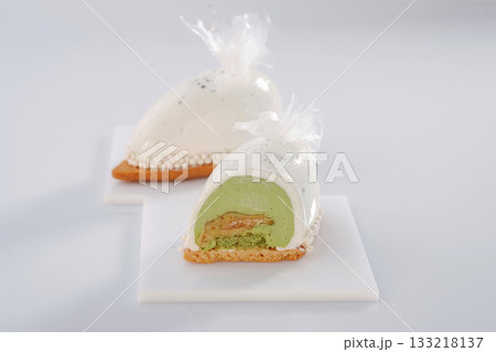 Detailed view. Delicious cake against white background Detailed view. Delicious cake against white background 133218137
