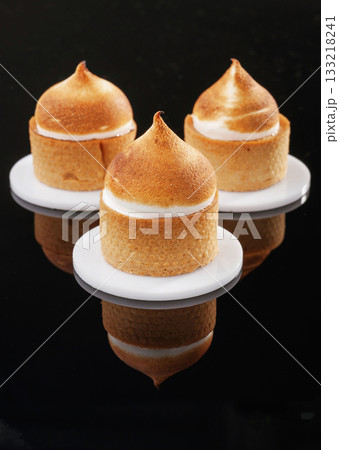 Sweet and tasty. Delicious cake against black background Sweet and tasty. Delicious cake against black background 133218241