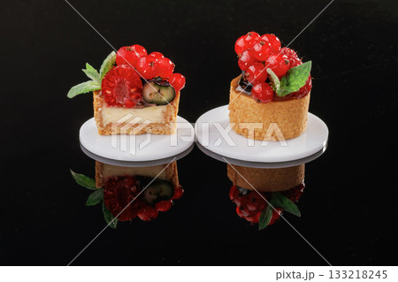 Vibrant fruit. Desserts, sweets on the black background Vibrant fruit. Desserts, sweets on the black background 133218245