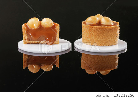 On the black background. Desserts, sweets On the black background. Desserts, sweets 133218256