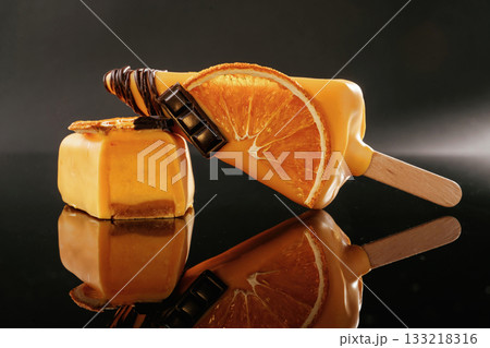 Side view. Tasty cheesecakes on the black background Side view. Tasty cheesecakes on the black background 133218316