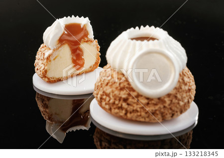 Gourmet dessert. Delicious cake against black background Gourmet dessert. Delicious cake against black background 133218345