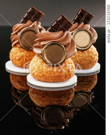 Quality product. Delicious cake against black background 133218360