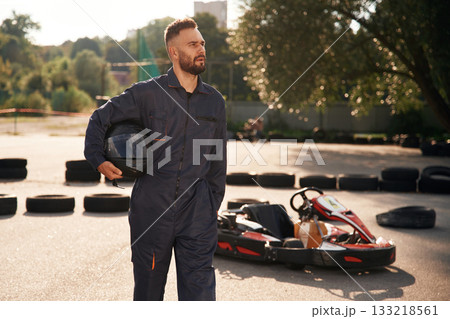 Having a walk, taking a break. Man is outdoors, kart racing conception Having a walk, taking a break. Man is outdoors, kart racing conception 133218561