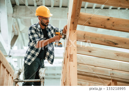 Industrial worker in wooden warehouse 133218995