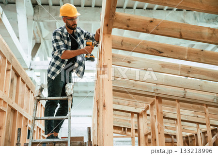 Industrial worker in wooden warehouse Industrial worker in wooden warehouse 133218996