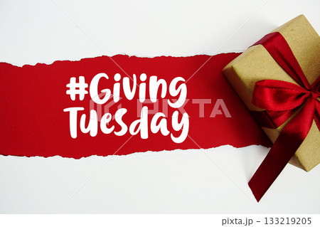 Giving Tuesday text with gift box present on red background 133219205