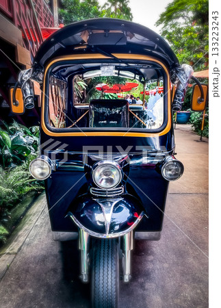 This colorful tuk-tuk is a popular mode of transportation in Thailand, often seen in busy urban areas This colorful tuk-tuk is a popular mode of transportation in Thailand, often seen in busy urban areas 133223243