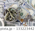 Dollars banknotes in a glass jar on bills background. 133223442