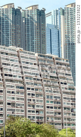 The building's facade features a distinctive pattern of windows and balconies, creating a visually appealing structure 133223822