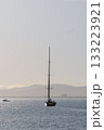 Sailing Yacht Underway Leaving Port At Dawn 133223921