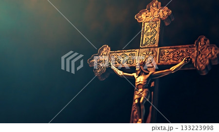 Cross with a man holding it in the middle 133223998