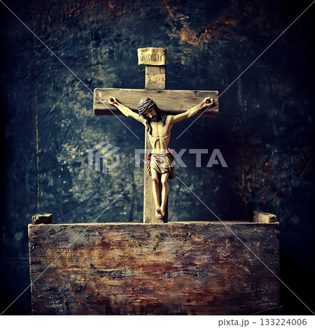 Wooden cross with a statue of Jesus Christ on top of it 133224006