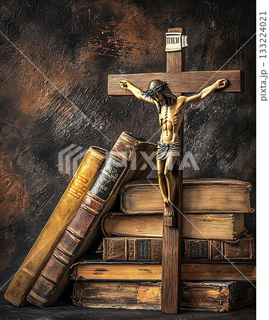 Wooden cross is on top of a stack of books 133224021