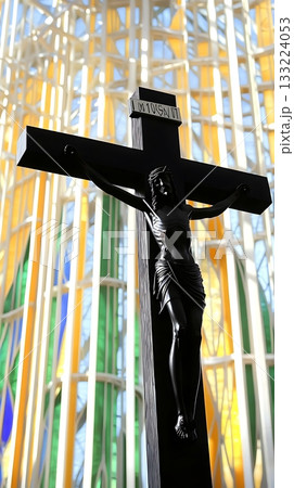 Black cross with a man on top of it Black cross with a man on top of it 133224053