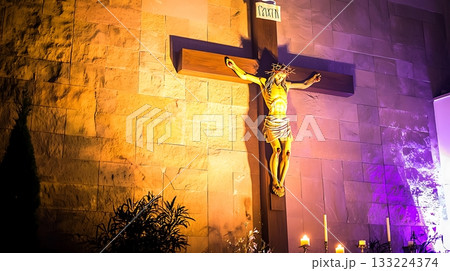 Cross with a statue of Jesus Christ on it 133224374