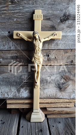 Wooden cross with a man on it 133224446