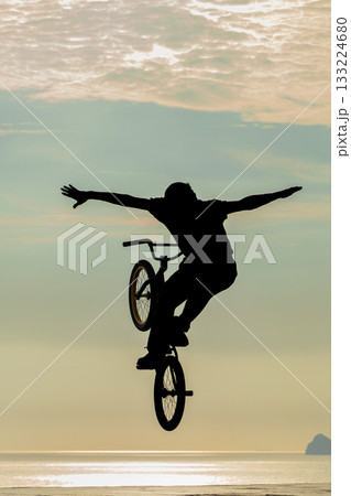 Freestyle cyclist practicing street BMX 133224680