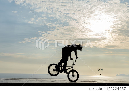 Freestyle cyclist practicing street BMX 133224687