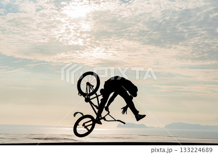Freestyle cyclist practicing street BMX Freestyle cyclist practicing street BMX 133224689
