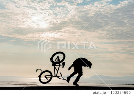 Freestyle cyclist practicing street BMX 133224690