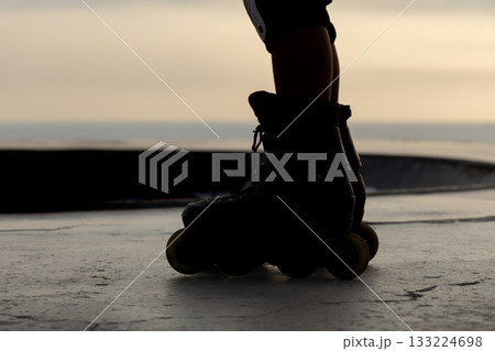 Freestyle skater practices with his roller skates 133224698