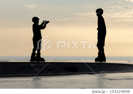 Freestyle skater practices with his roller skates 133224699