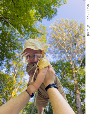 Joyful Baby Lifted in Forest 133224790