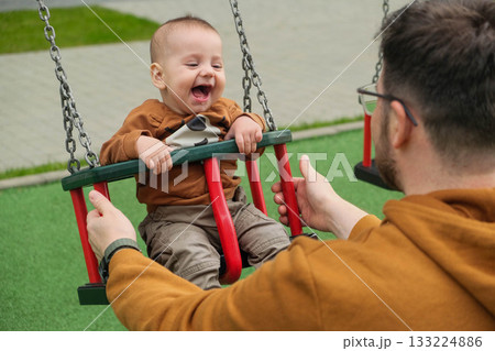 Father and Baby Enjoying Swing Time Father and Baby Enjoying Swing Time 133224886