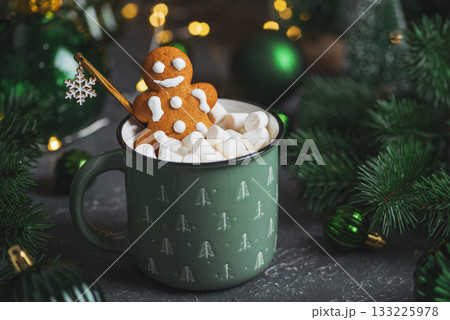 Gingerbread Cookie Man into Christmas Mug with Marshmallows and Festive Decor 133225978