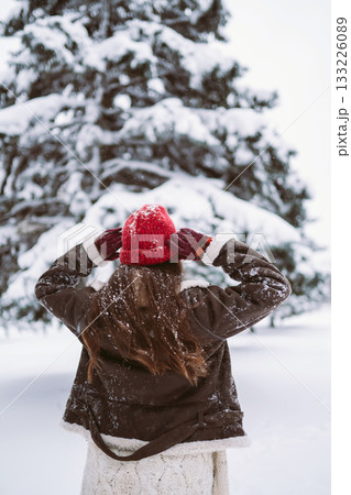 young woman plays with a snow in sunny winter day. Christmas, holidays concept. 133226089