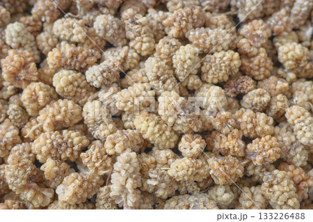 Close up photo of dried white mulberry, selective focus. Close up photo of dried white mulberry, selective focus. 133226488
