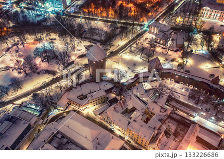 Aerial night View of Tallinn in winter, roofs are covered with snow, Christmas mood Aerial night View of Tallinn in winter, roofs are covered with snow, Christmas mood 133226686