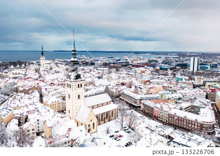 Aerial View of Tallinn in winter, roofs are covered with snow, Christmas mood 133226706