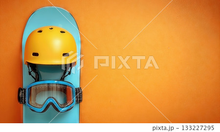 Snowboard Helmet and Goggles Rest on a Colorful Board Against a Bright Background Snowboard Helmet and Goggles Rest on a Colorful Board Against a Bright Background 133227295