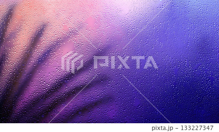 Close up of Frosted Windowpane With Soft Light Creating a Dreamy Atmosphere and Colorful Patterns 133227347
