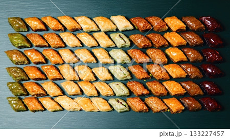 Assorted Maghrebi Sweets Featuring Baklava and Makrout Displayed in an Elegant Flat Lay Assorted Maghrebi Sweets Featuring Baklava and Makrout Displayed in an Elegant Flat Lay 133227457