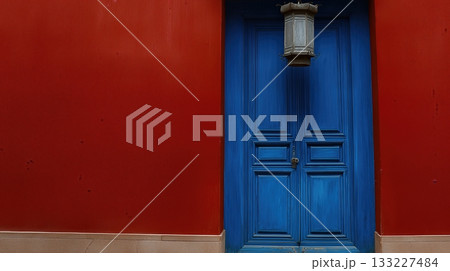 Bright Blue Door Contrasts With Red Wall in a Traditional Chinese Architectural Setting Bright Blue Door Contrasts With Red Wall in a Traditional Chinese Architectural Setting 133227484