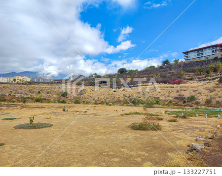 A breathtaking scenic landscape showcasing dry grass under a vibrant blue sky above 133227751