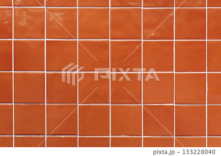 Orange ceramic tile background. Old vintage ceramic tiles in green to decorate the kitchen or bathroom  133228040